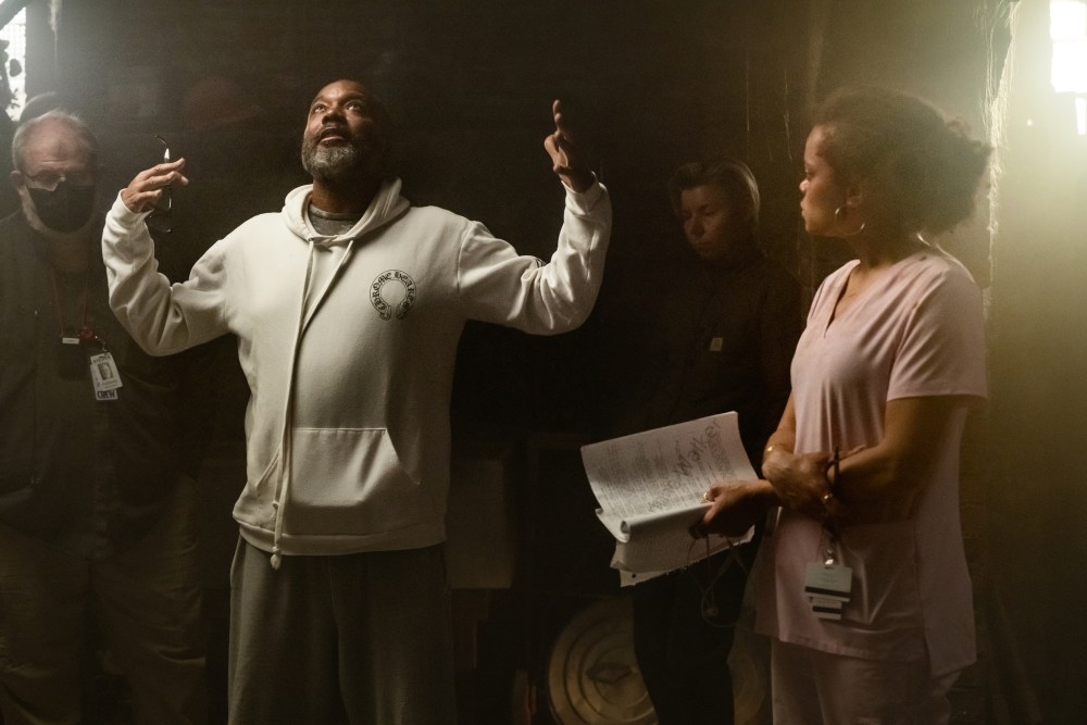 The Deliverance. (L to R) Lee Daniels - Director/Producer/Writer and Andra Day as Ebony on the set of The Deliverance. Cr. Aaron Ricketts/Netflix © 2024