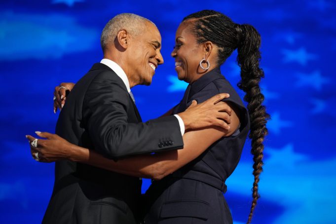 CHICAGO, ILLINOIS - AUGUST 20: Former U.S. President Barack Obama (L) greets former first lady Michelle Obama as he arrives to speak on stage during the second day of the Democratic National Convention at the United Center on August 20, 2024 in Chicago, Illinois. Delegates, politicians, and Democratic Party supporters are gathering in Chicago, as current Vice President Kamala Harris is named her party's presidential nominee. The DNC takes place from August 19-22. (Photo by Andrew Harnik/Getty Images)
